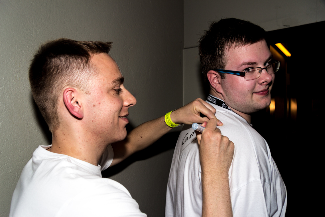 Cast DJ signing a shirt